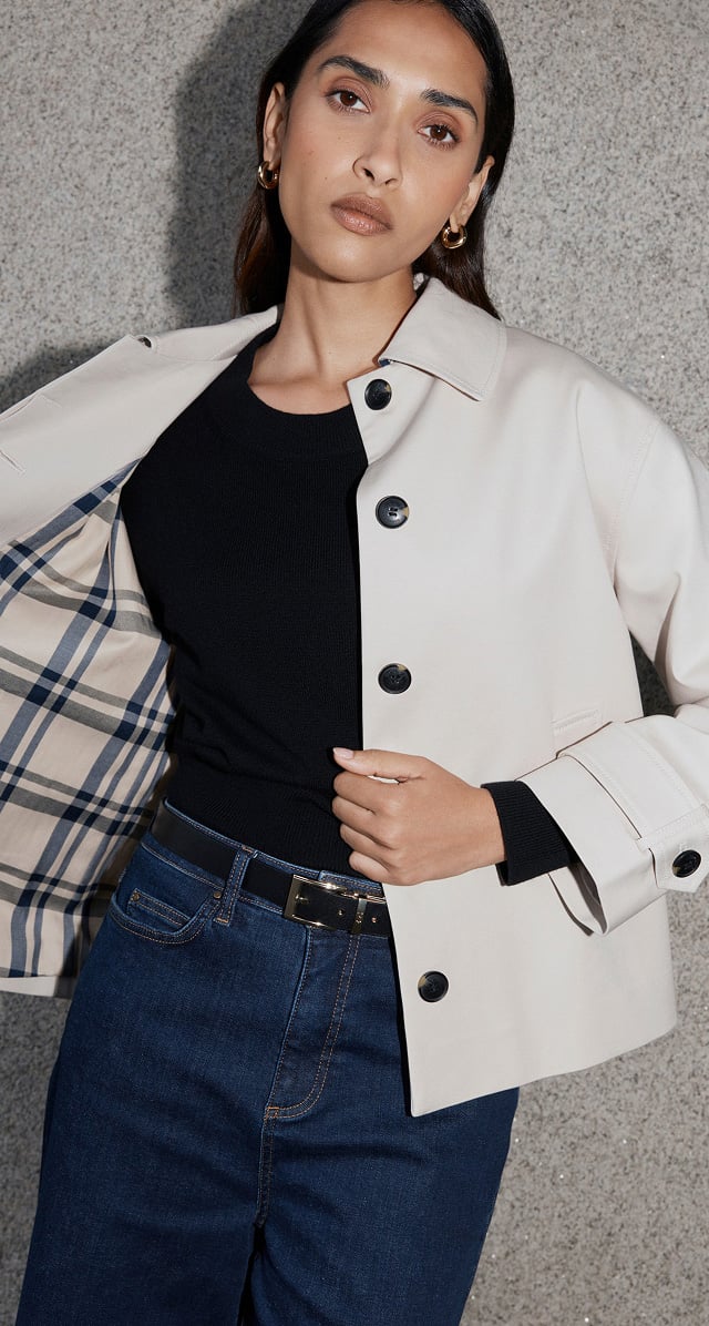 A woman wearing a Hobbs trench coat.