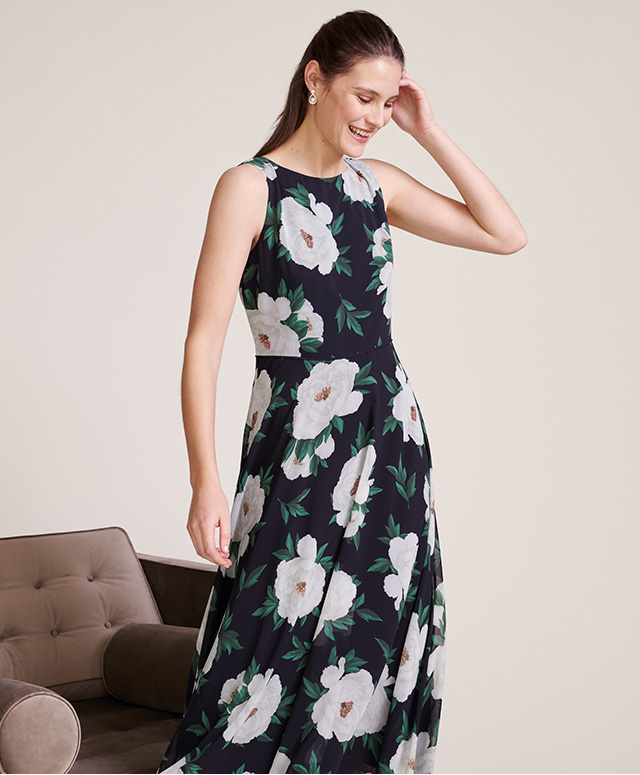 Model photographed wearing Hobbs Carly dress with a peony floral print.