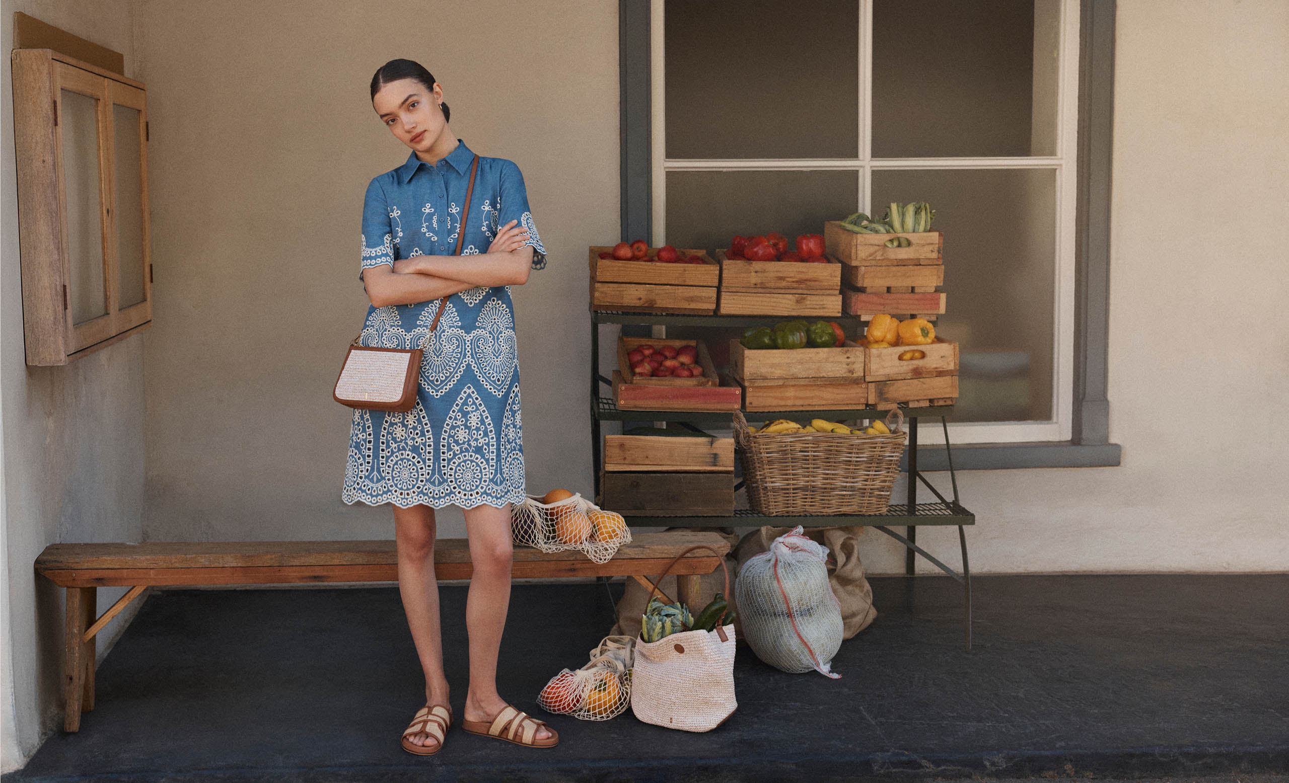 A woman wearing a Hobbs chambray dress.