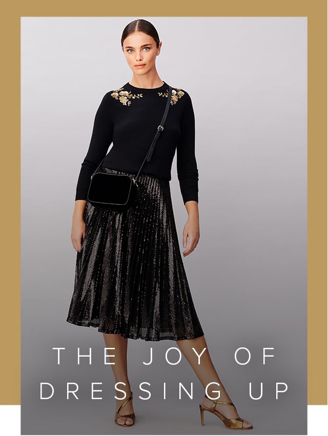 Sequin midi skirt worn with an embellished jumper, velvet crossbody bag and metallic heeled sandals from Hobbs.
