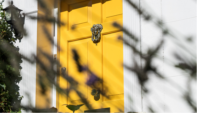 A yellow london front door to Hobbs Senior Trading manager's hobbs at home