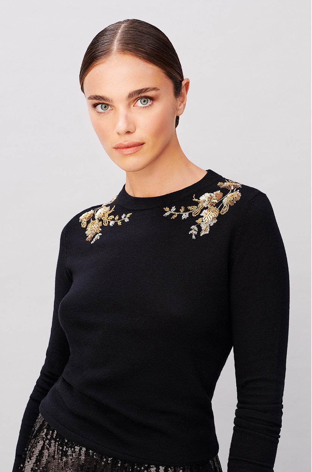 Model wears an embroidered jumper from Hobbs.