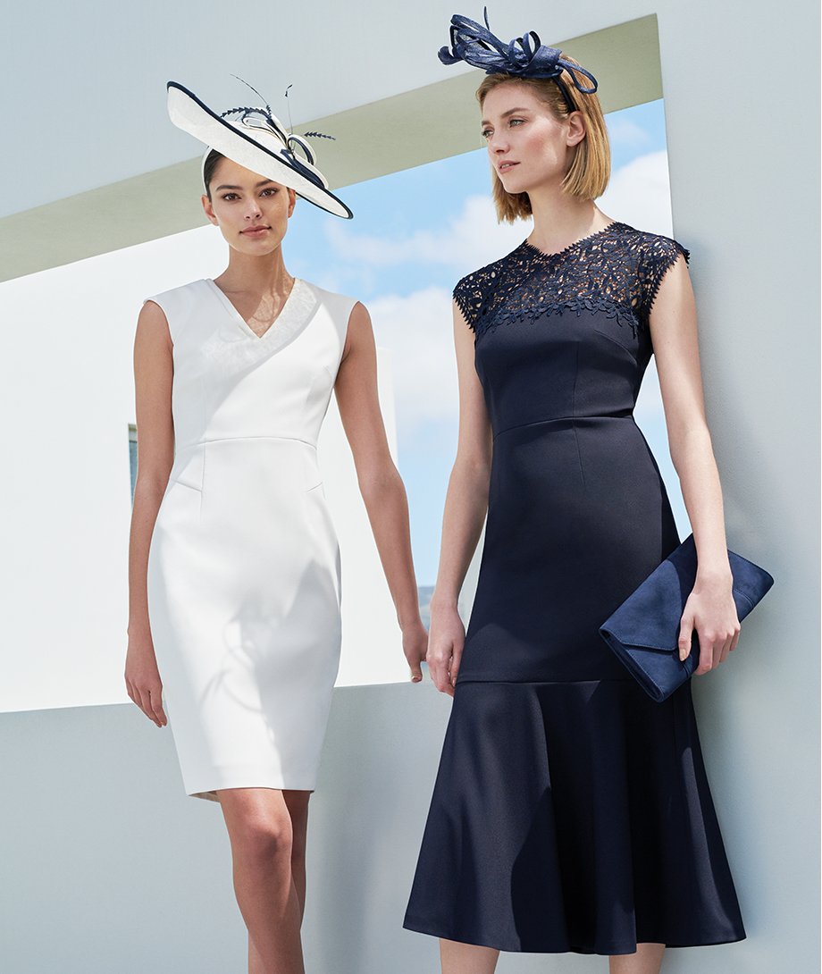 White occasion dress and navy occasion dress with matching fascinators by Hobbs.