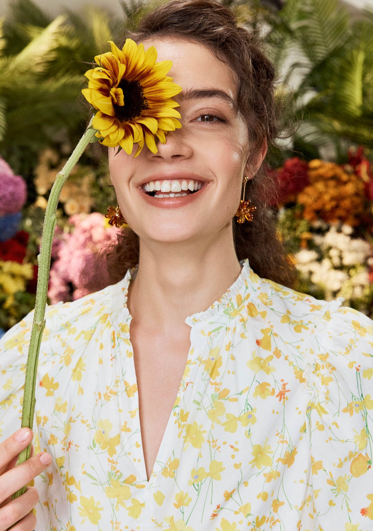 A woman wearing a Hobbs ditsy floral dress.