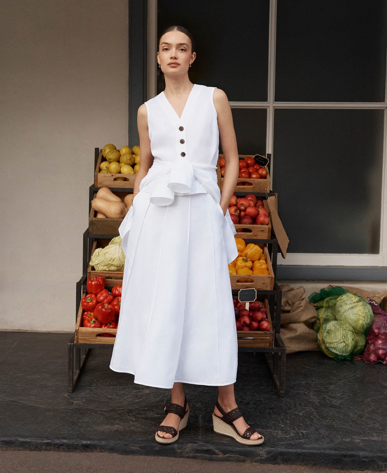 A woman wearing Hobbs Wimbledon outfits.