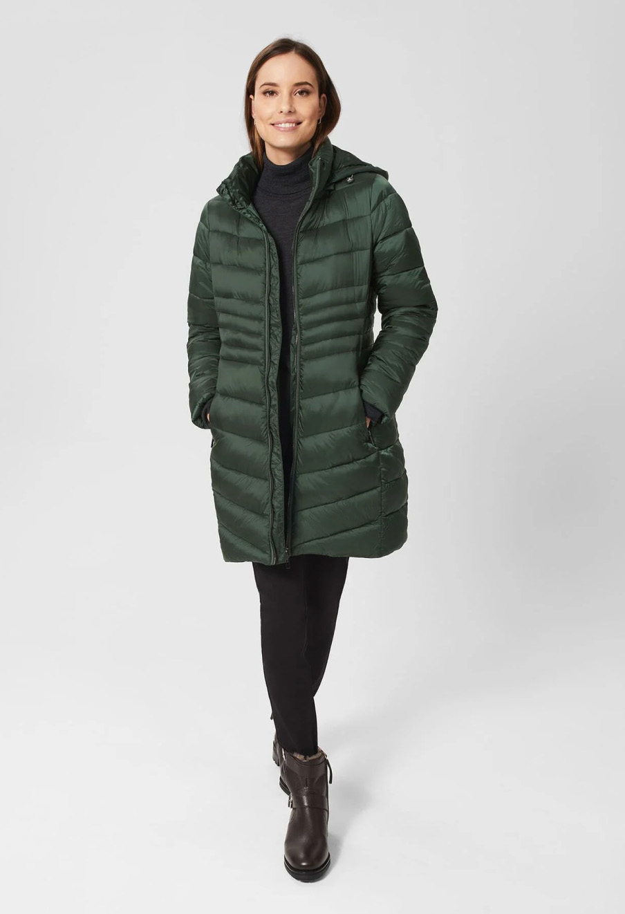 Model wears a Hobbs puffer with panel detailing.