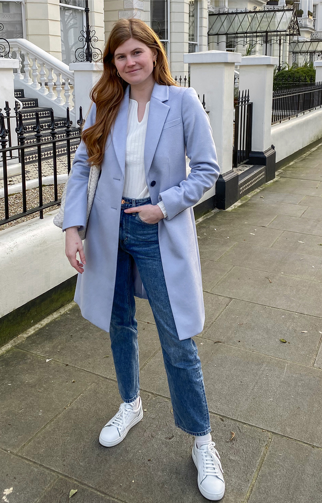 Fashion blogger @mollie_moore__ photographed on a walk wearing Hobbs Tilda blue coat, Vanessa jumper,Sukey jeans and Freda trainers.