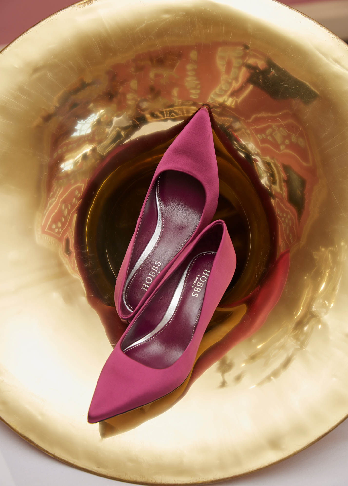 A close-up image of satin party shoes.
