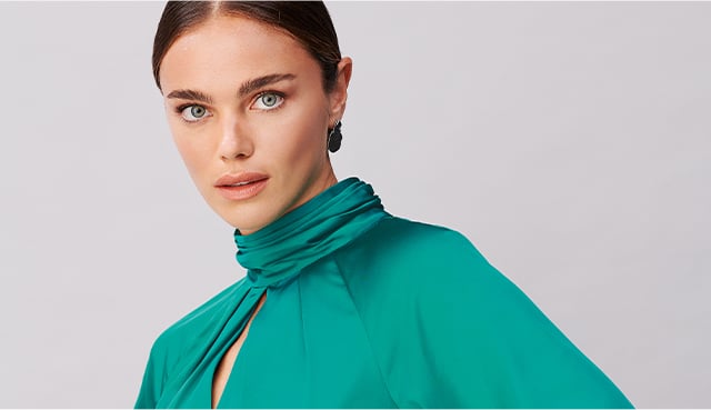 Model wears a satin blouse from Hobbs.