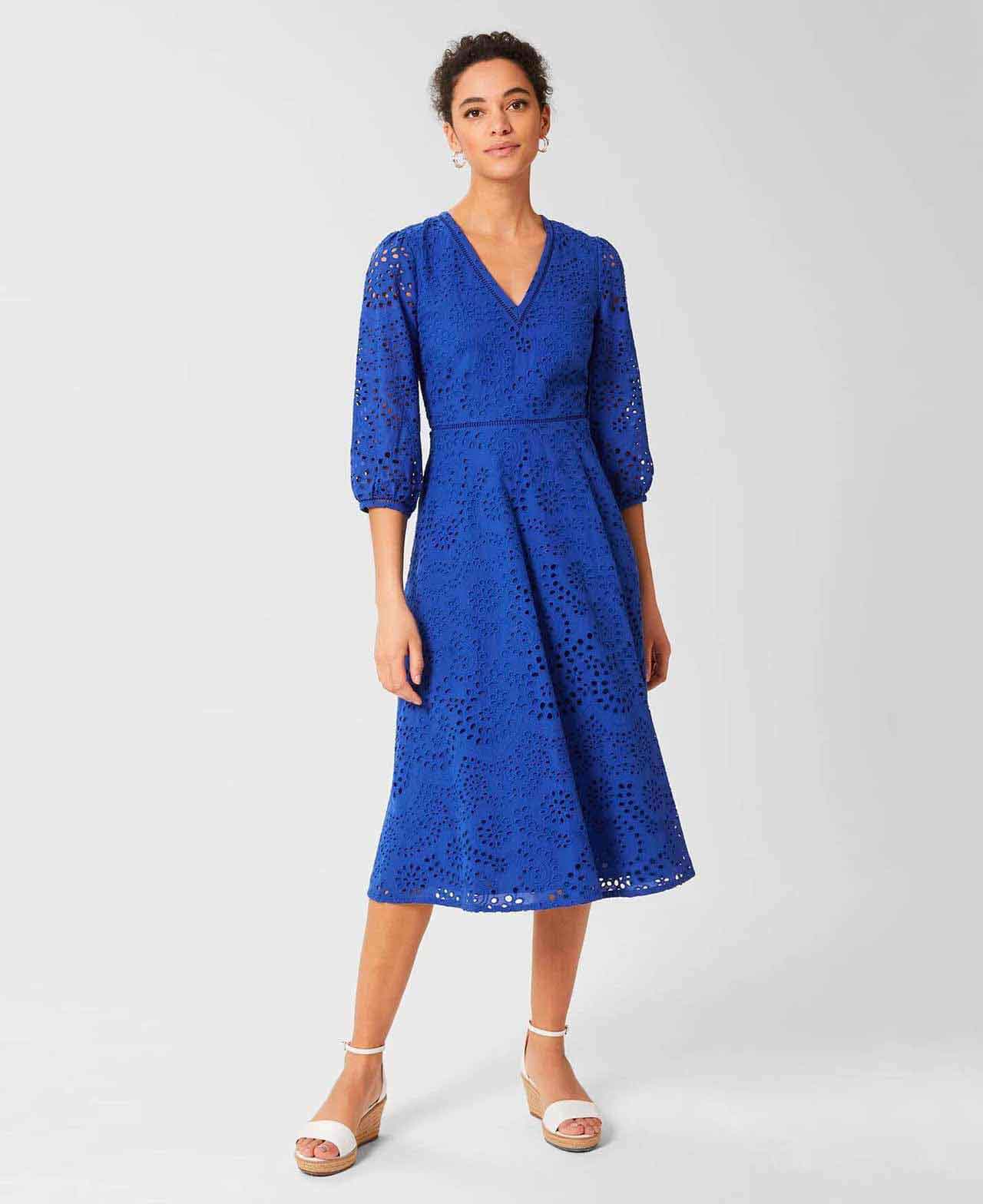 Hobbs model wears a blue broderie dress with white espadrille wedge sandals.