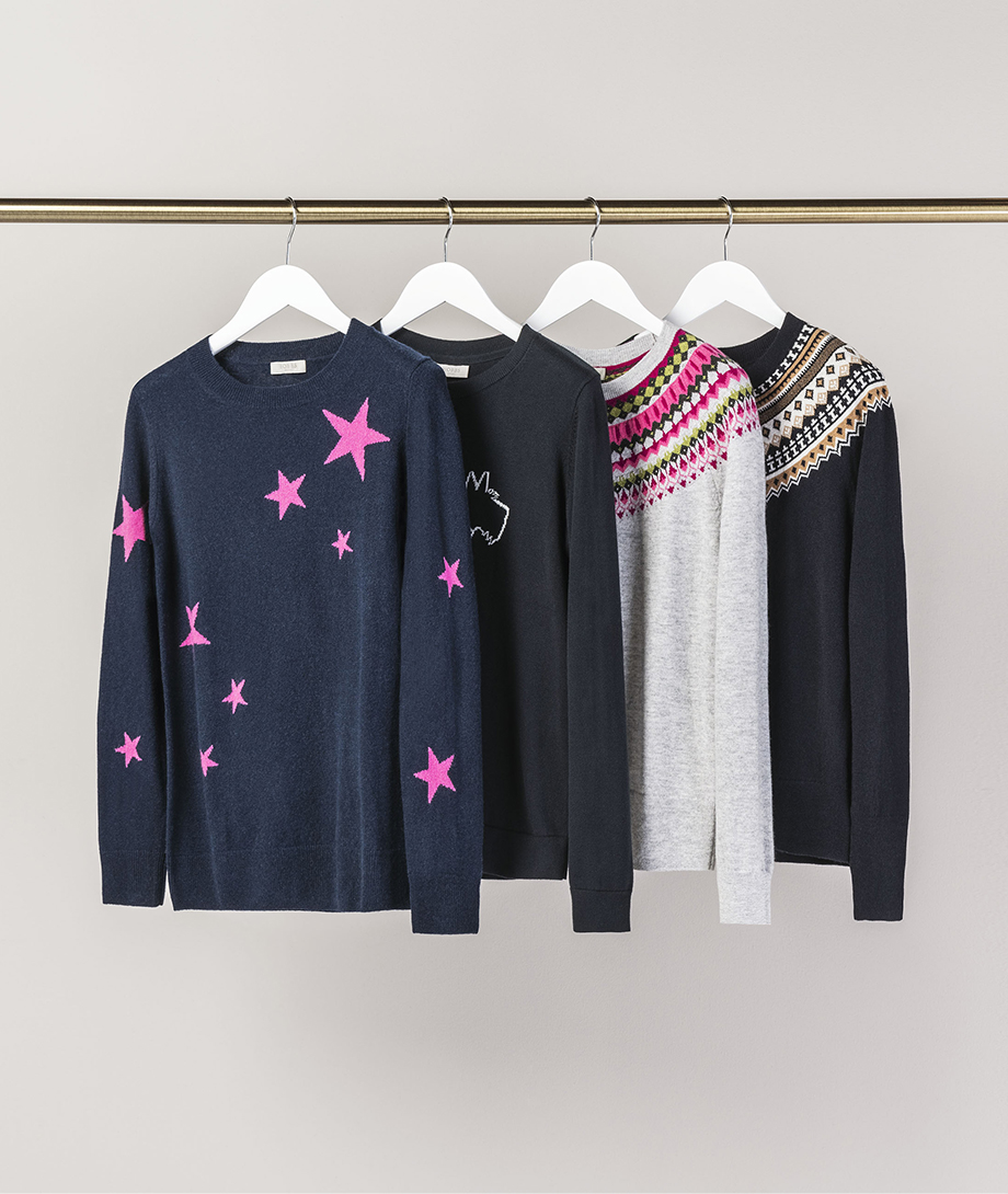 Wool jumpers from Hobbs hung on a rail.