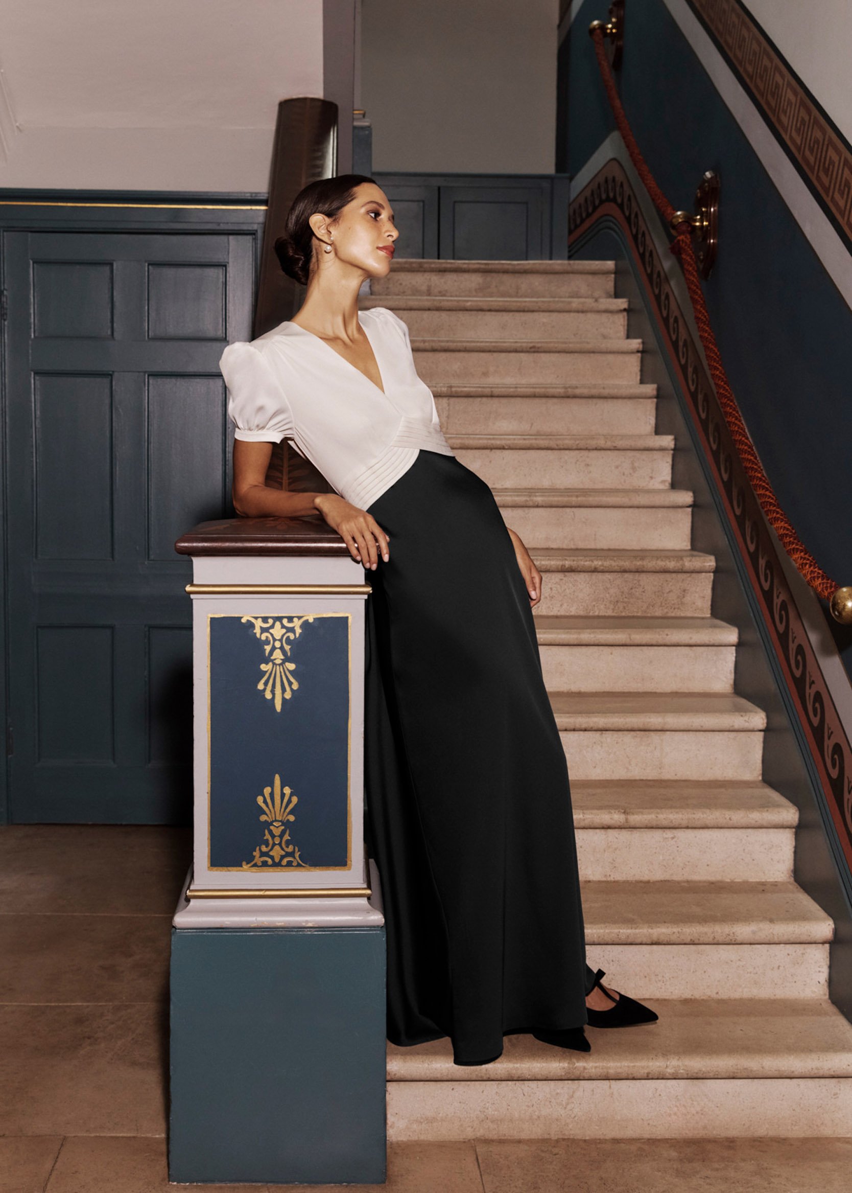 A woman wearing a Hobbs black and white ball gown.