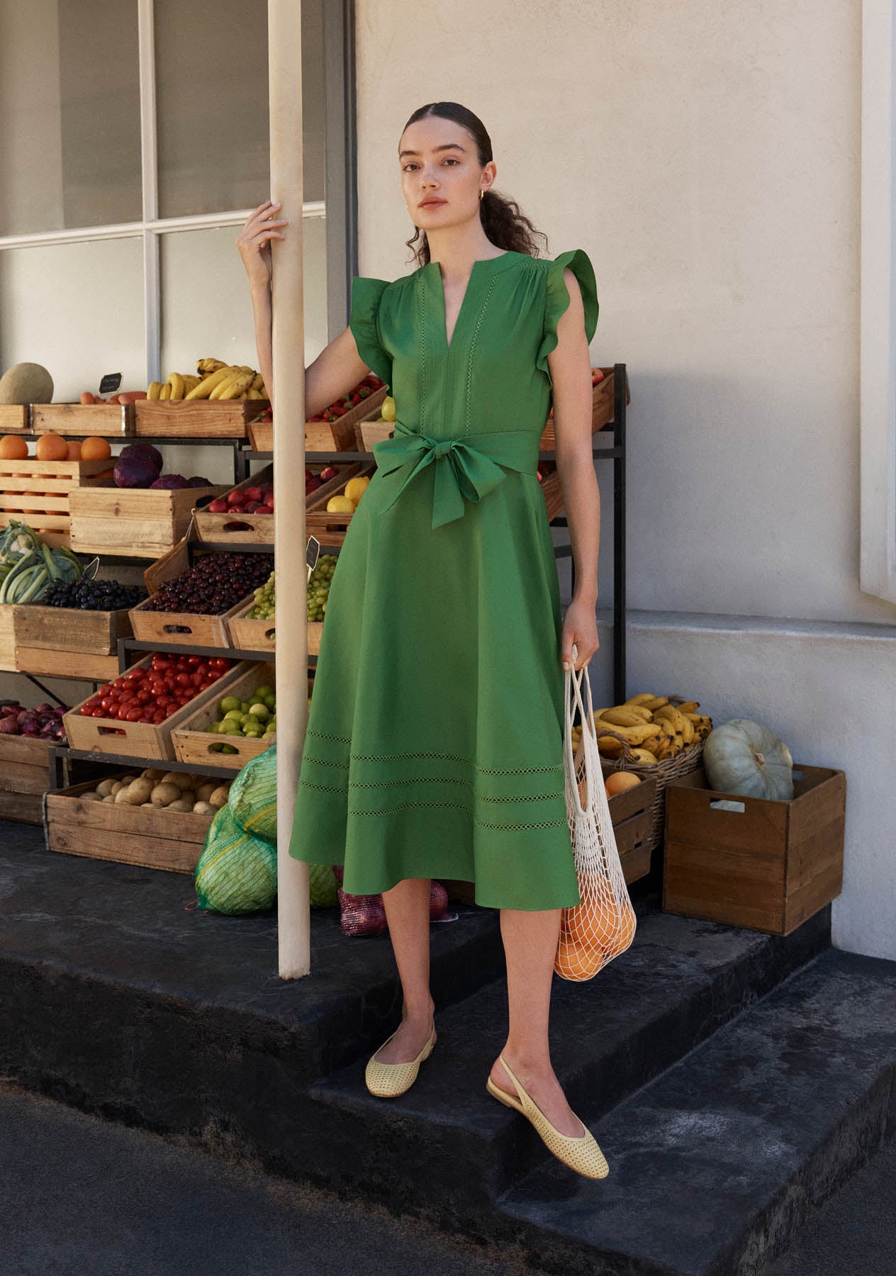 A woman wearing a Hobbs fit and flare dress