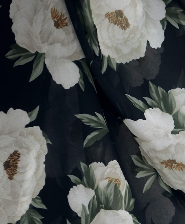 Close-up of peony floral print fabric.