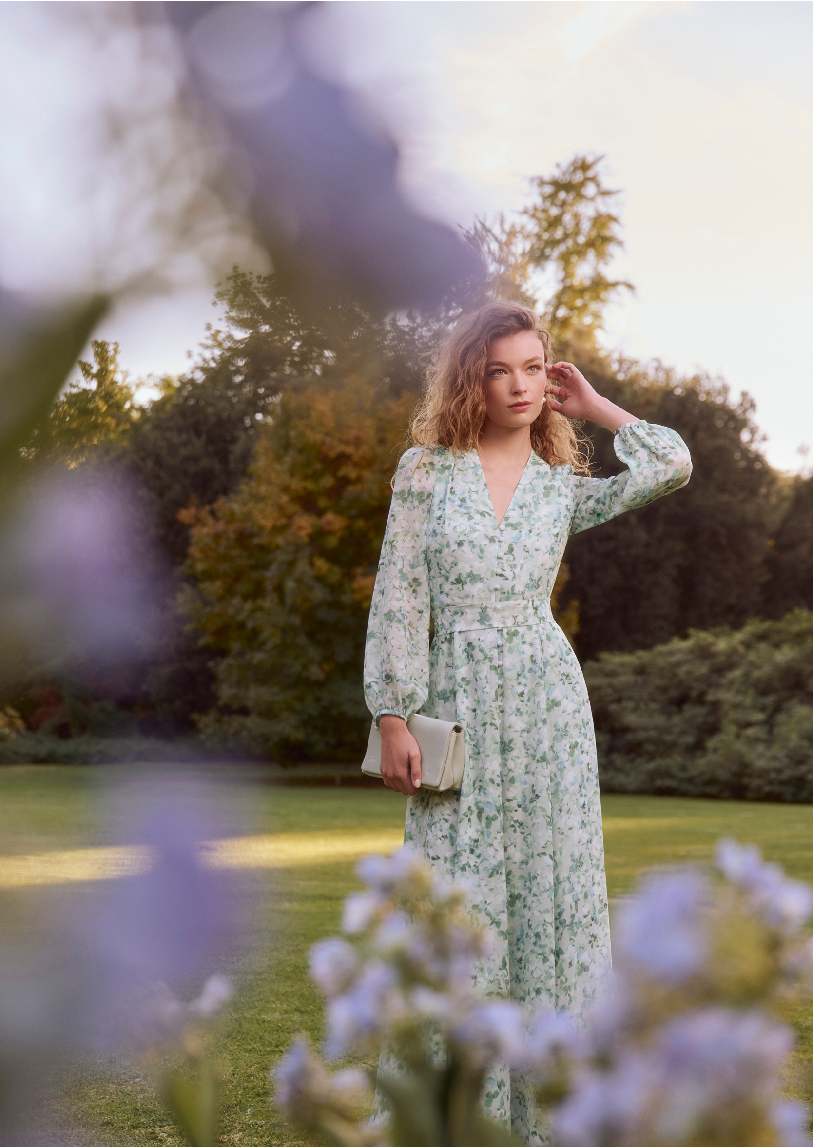 An image of a model wearing a Hobbs pink occasion dress.