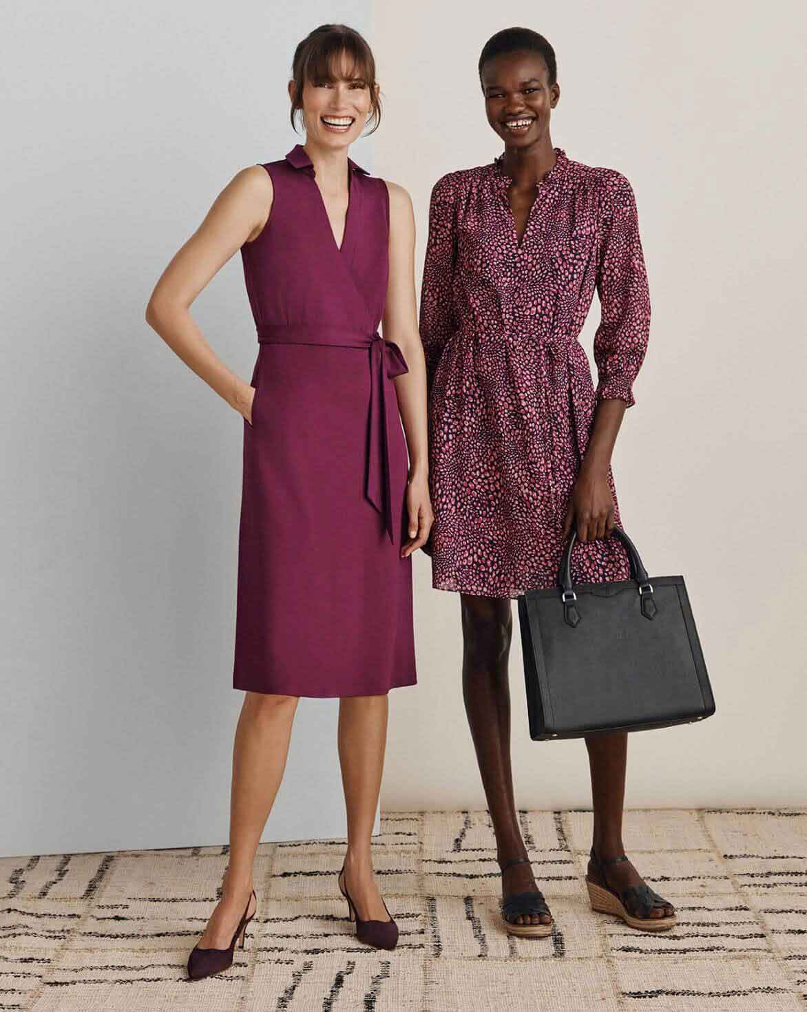 Two Hobbs models photographed wearing a plum wrap dress and pink leopard mini dress with coordinating accessories.