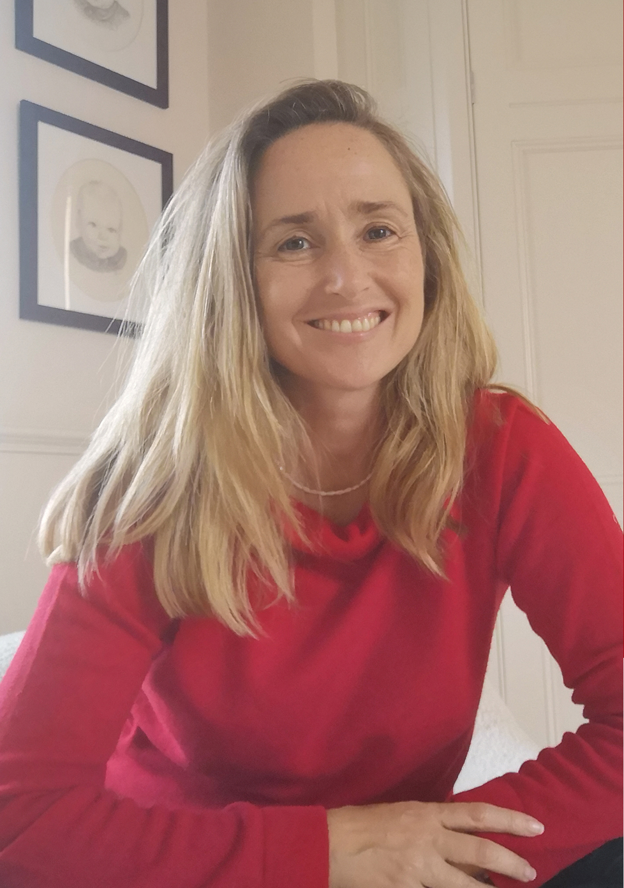Author Karen Swan photographed wearing a Hobbs red Audrey jumper. 