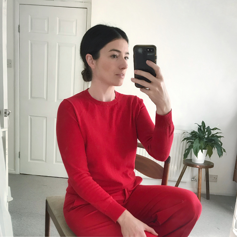 Brand Stylist, Maddy Moxham wears a monochrome flame red outfit at home. 