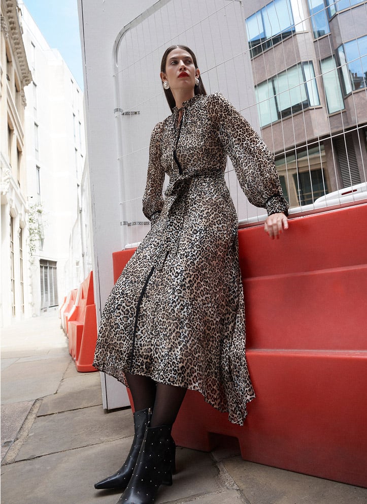 Model photographed in a leopard print dress.