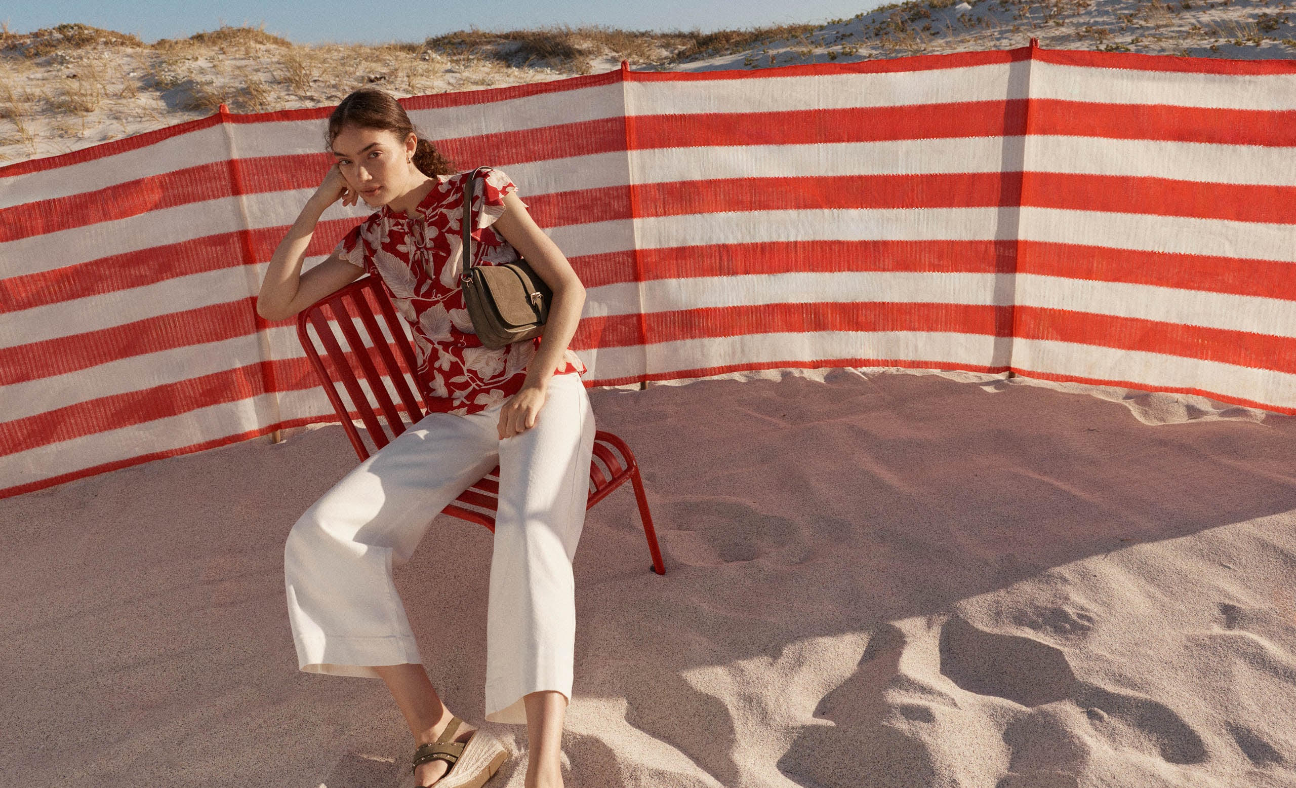 A woman wearing Hobbs’ summer collection.