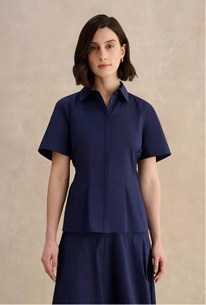 A woman wearing a Hobbs dress.