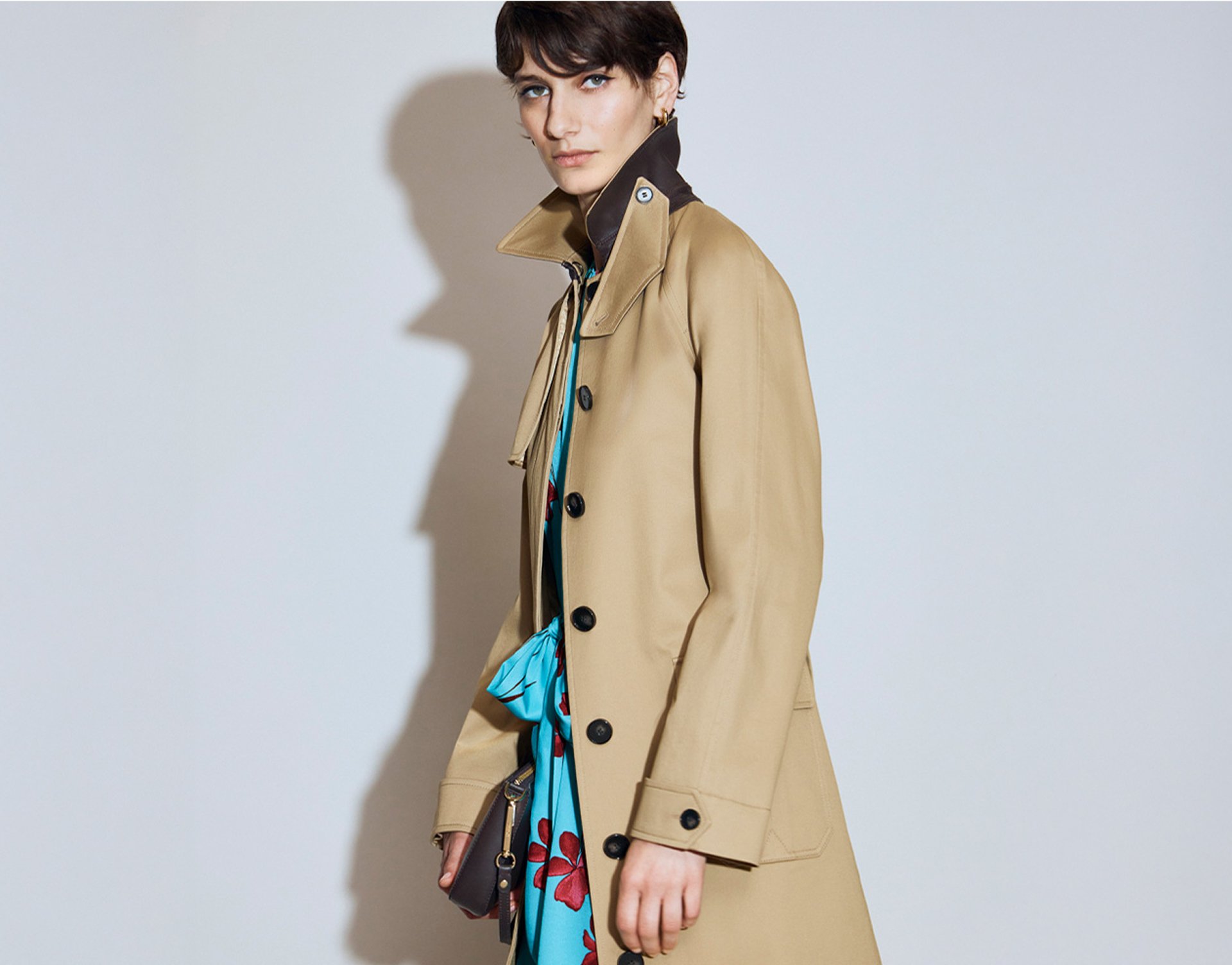 A woman wearing a Hobbs trench coat.