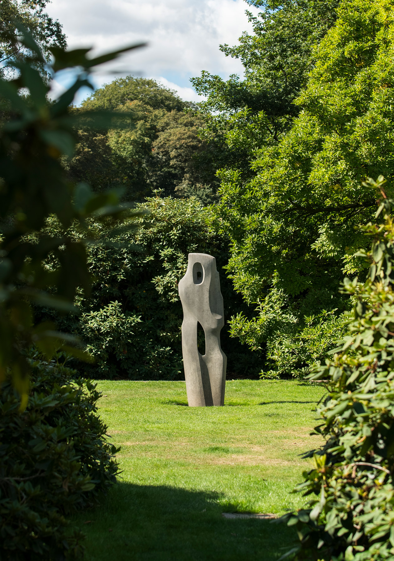 A sculpture appears in the opening amoungst the greenery of hampstead