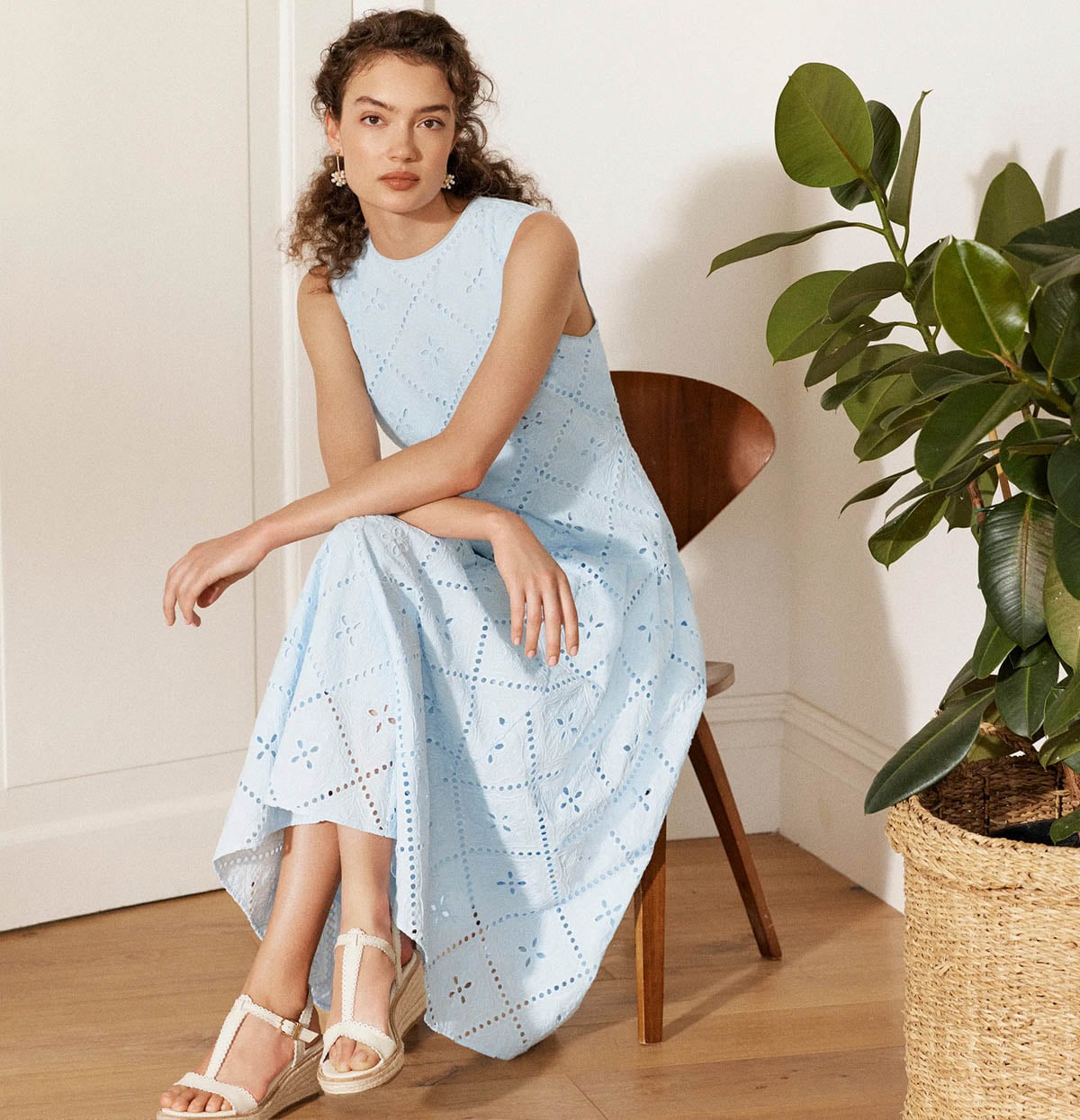 A woman wearing a Hobbs silk occasion dress.