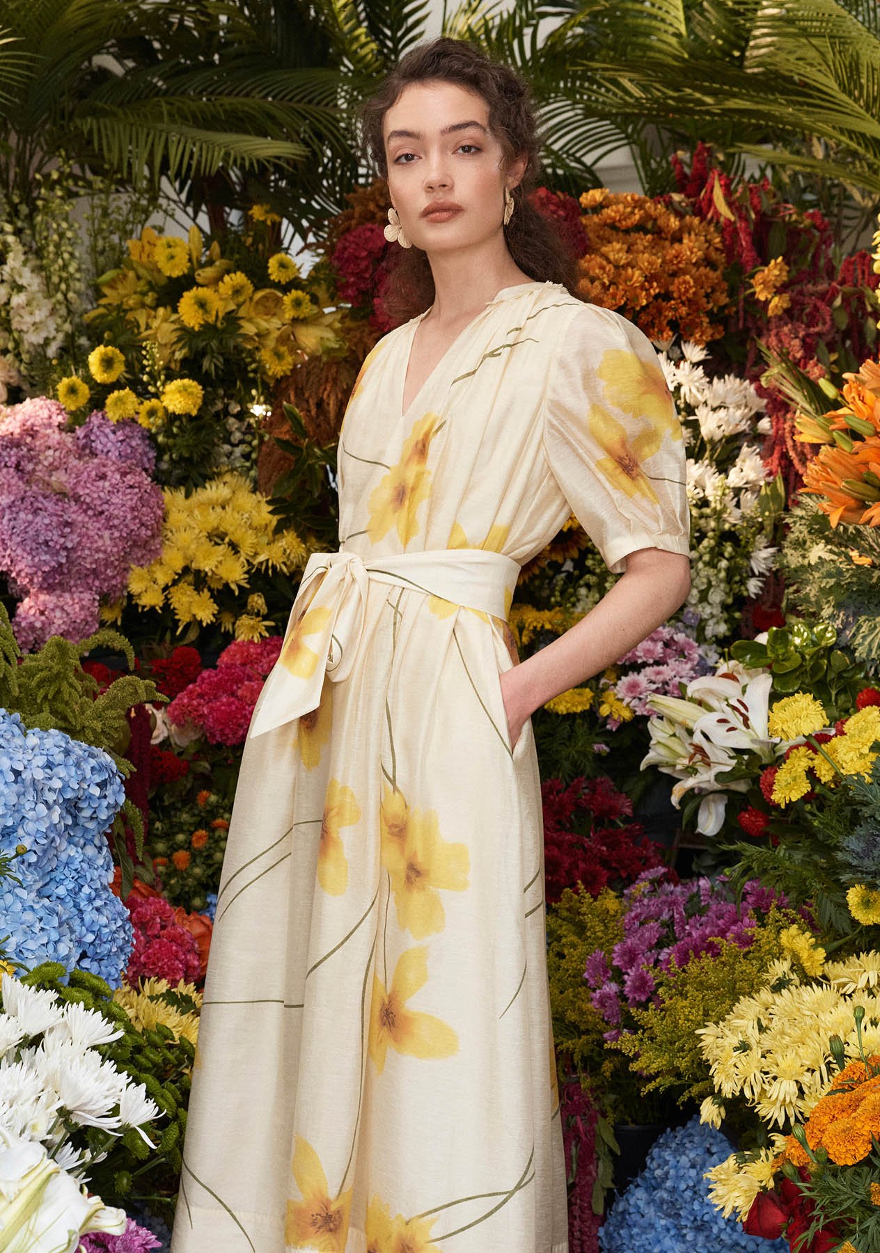 A woman wearing a floral print Hobbs dress.