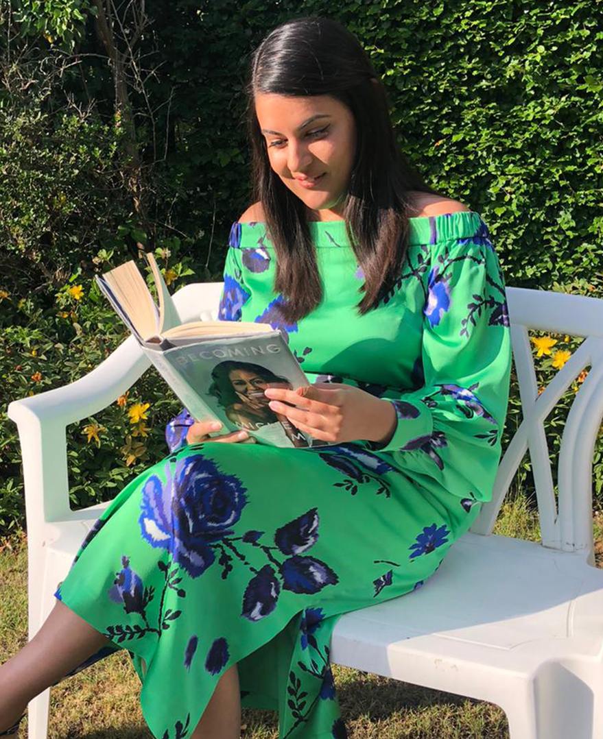 Priya reads Michelle Obama's Becoming at home in the Miriam Dress