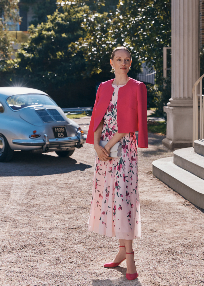 Gallery of four images showing models wearing wedding guest outfits.