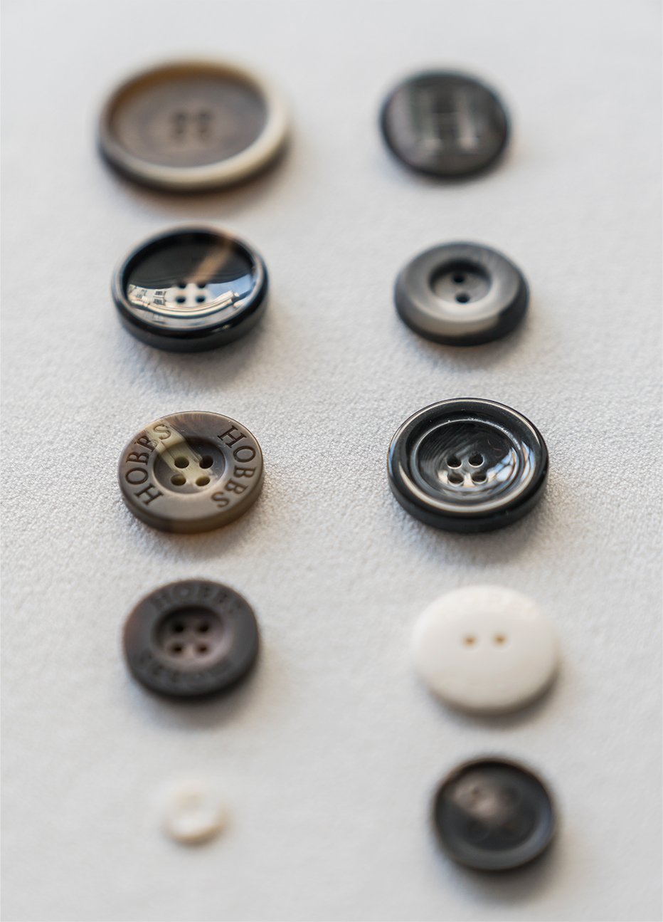Two rows of buttons used for garments.