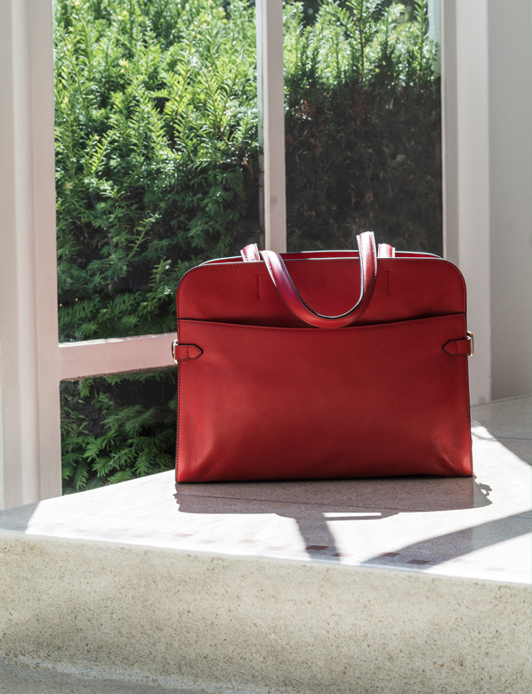 Red Tote Bag next to a Window