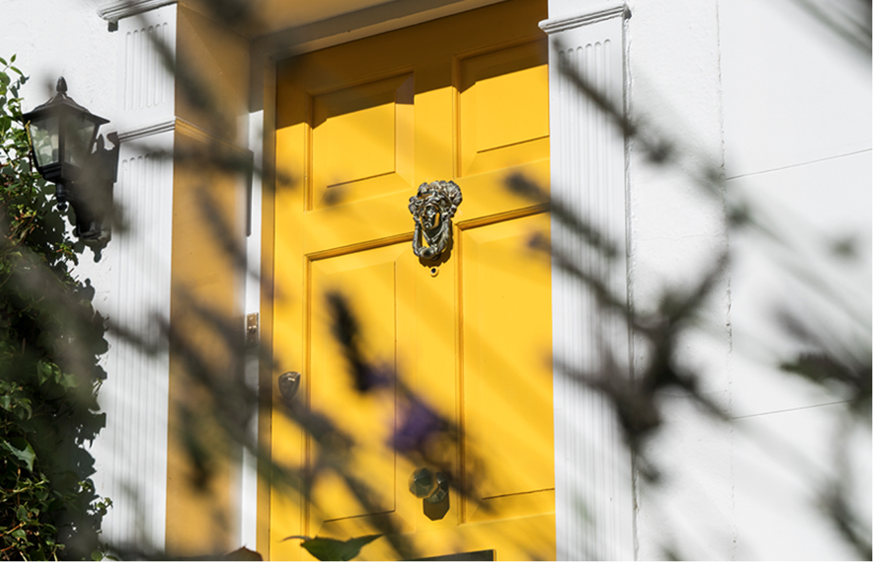 A yellow london front door to Hobbs Senior Trading manager's hobbs at home
