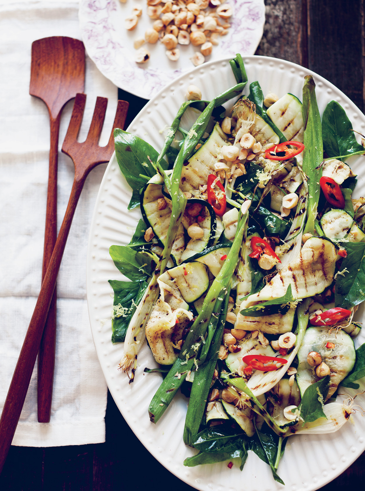 Sarah Britton's Grilled Courgette with Spring Onion and Hazelnut styled on a plate