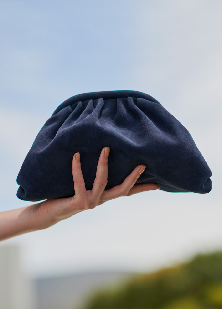 Navy blue suede clutch bag by Hobbs.