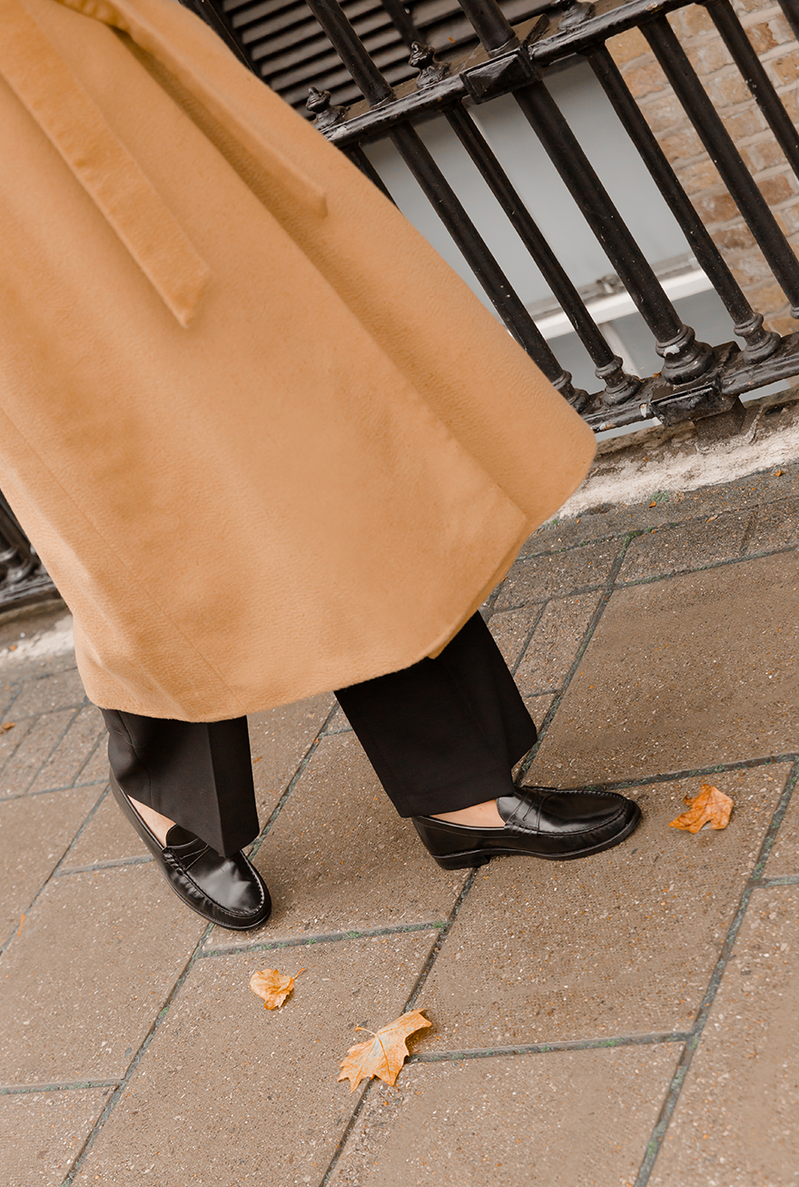 Hobbs' Product Director, Sally Ambrose, photographed wearing black loafers.