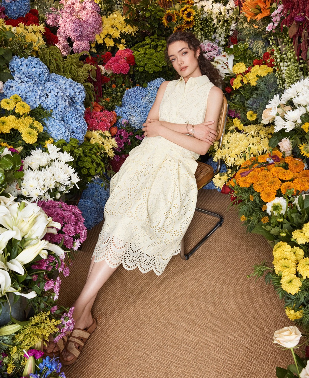 A woman wearing an yellow broderie skirt.