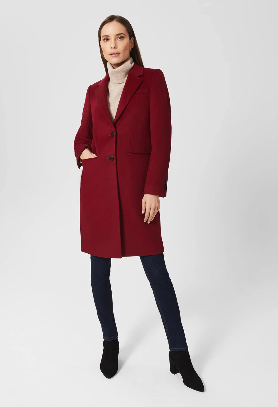 Model wears a Hobbs wool coat in red.
