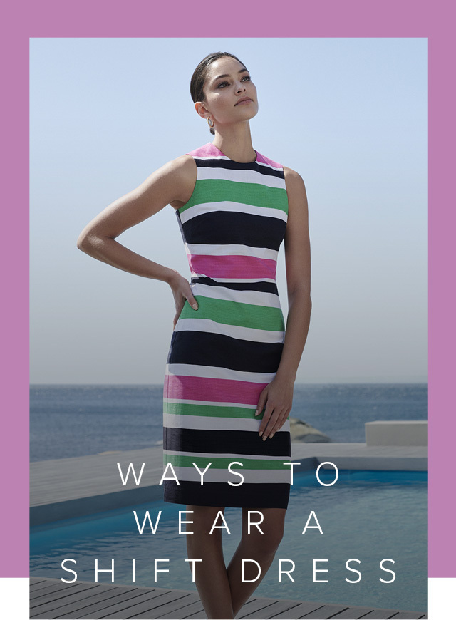 Hobbs model posing next to the pool by the seaside, wearing a multi coloured shift dress in pink, white, green and black paired with flat sandals in white. 