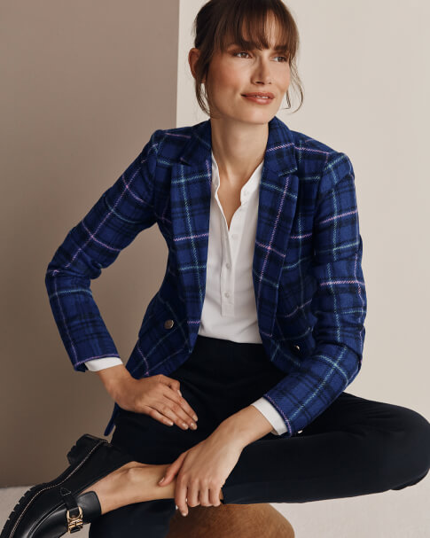 Hobbs model wears blue check blazer, ivory blouse and leather loafers.