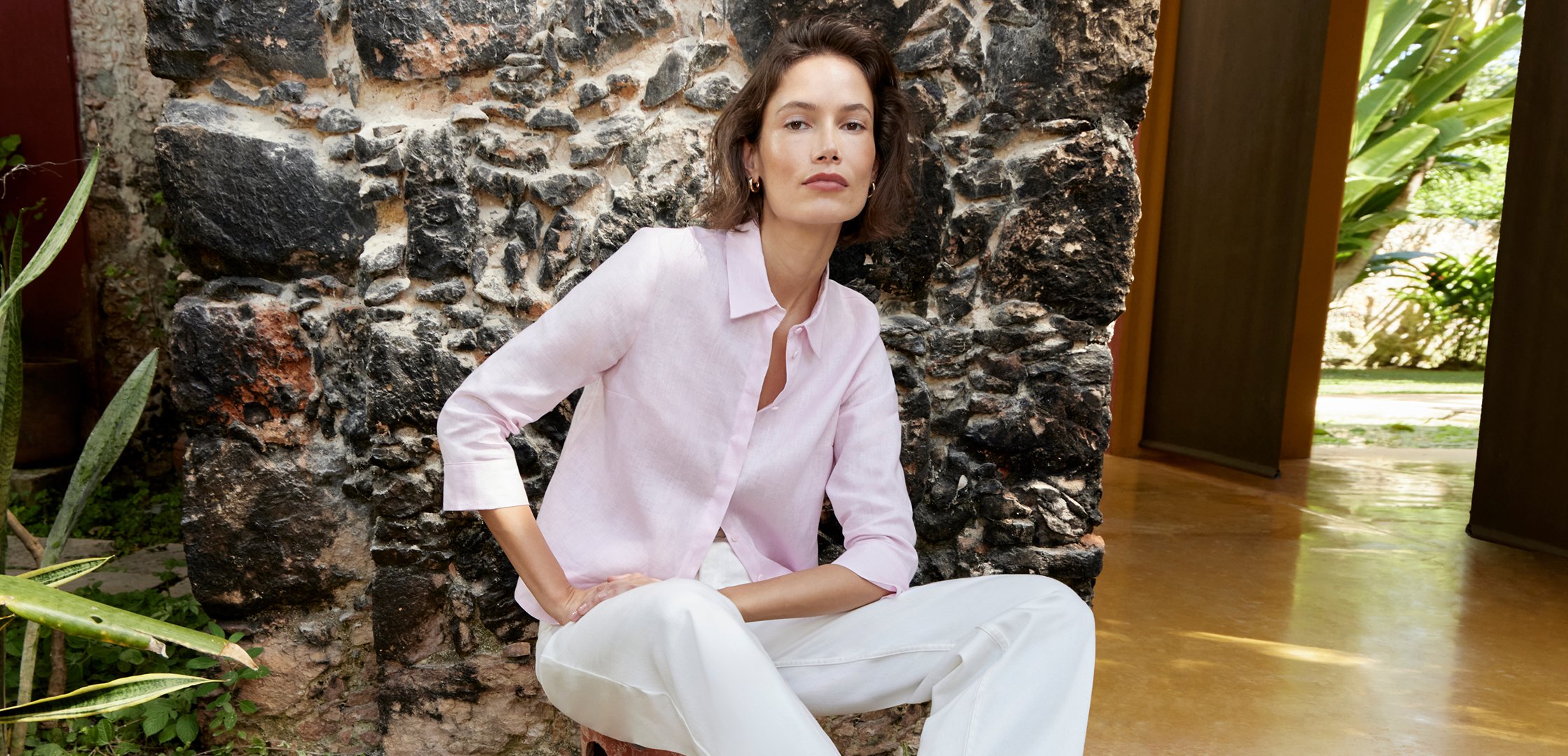 A woman wearing a Hobbs summer outfit.