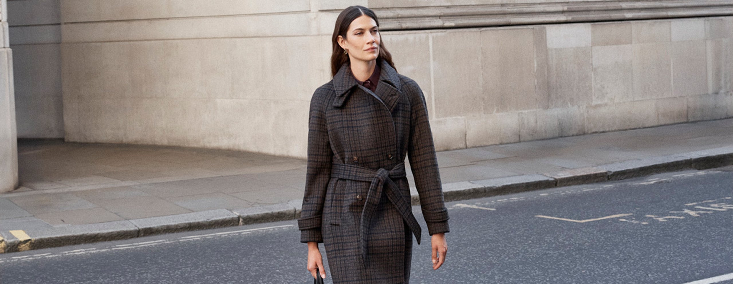 Model photographed in a coat.