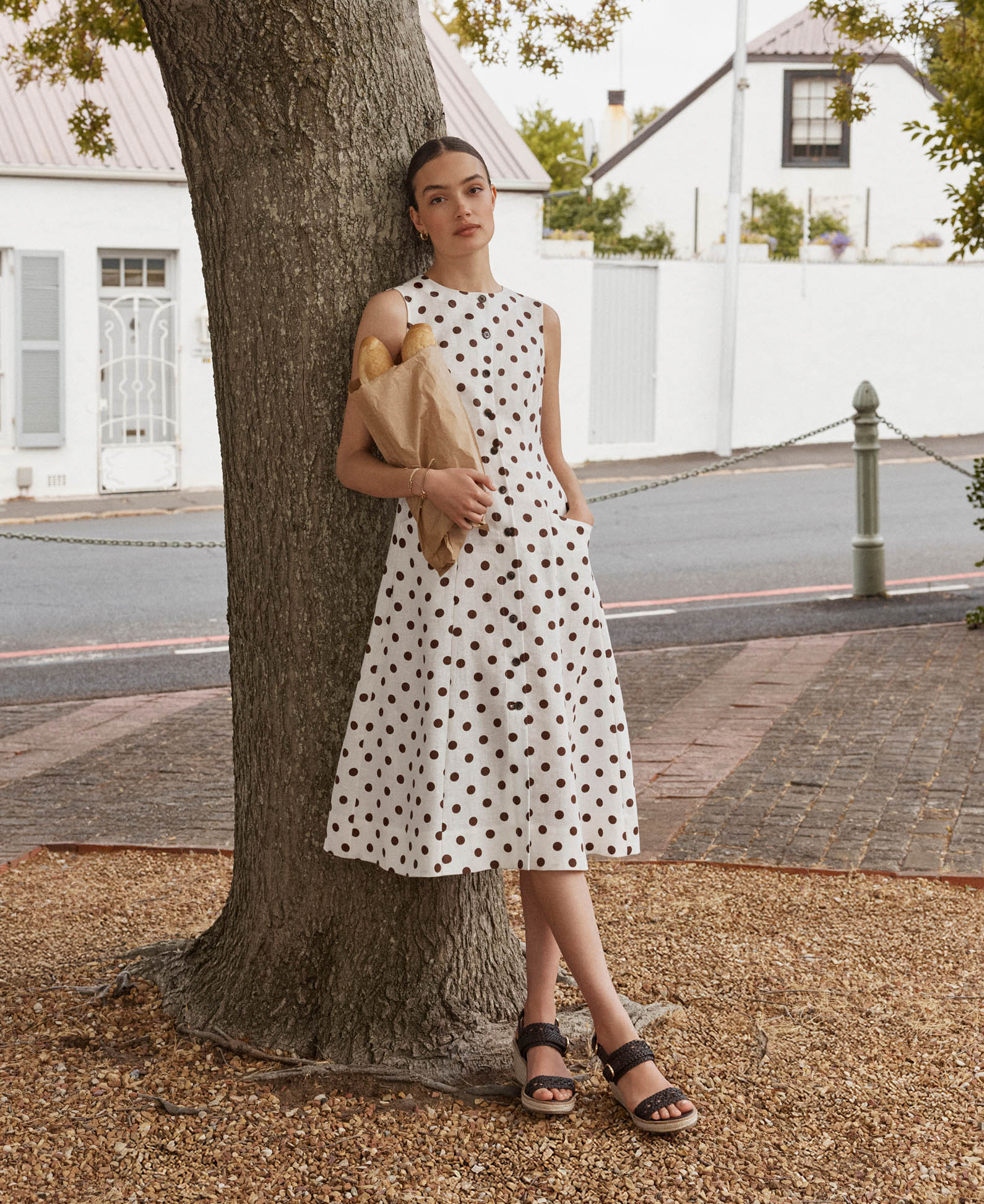 A woman wearing a Hobbs linen dress.