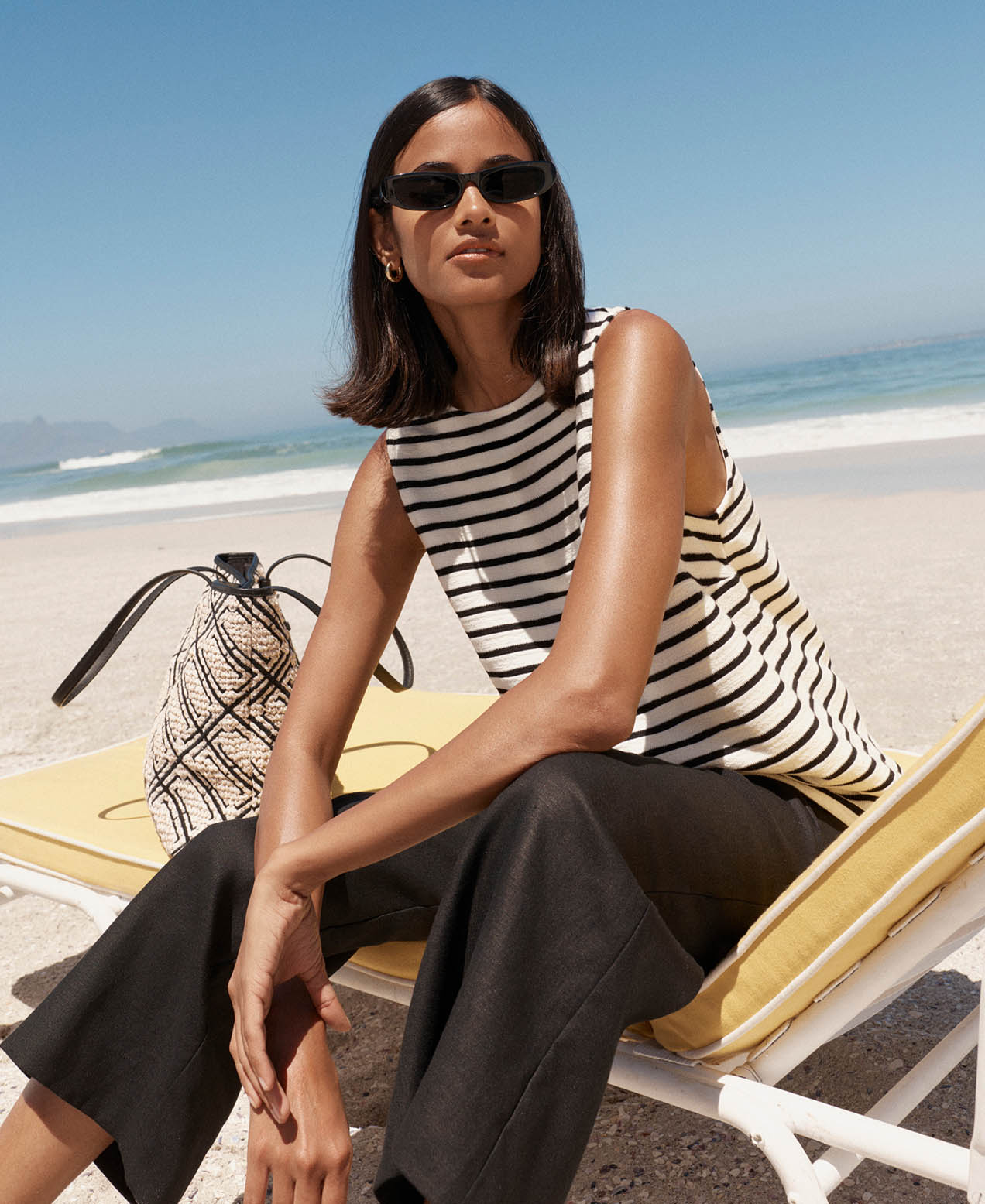 A woman wearing Hobbs linen trousers.