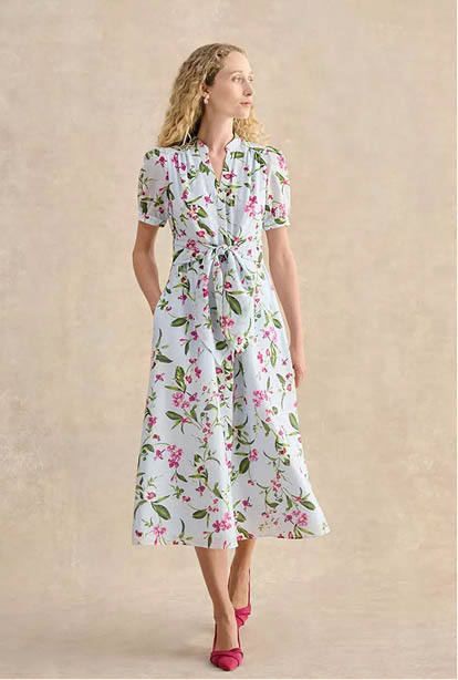 A woman wearing a Hobbs dress.