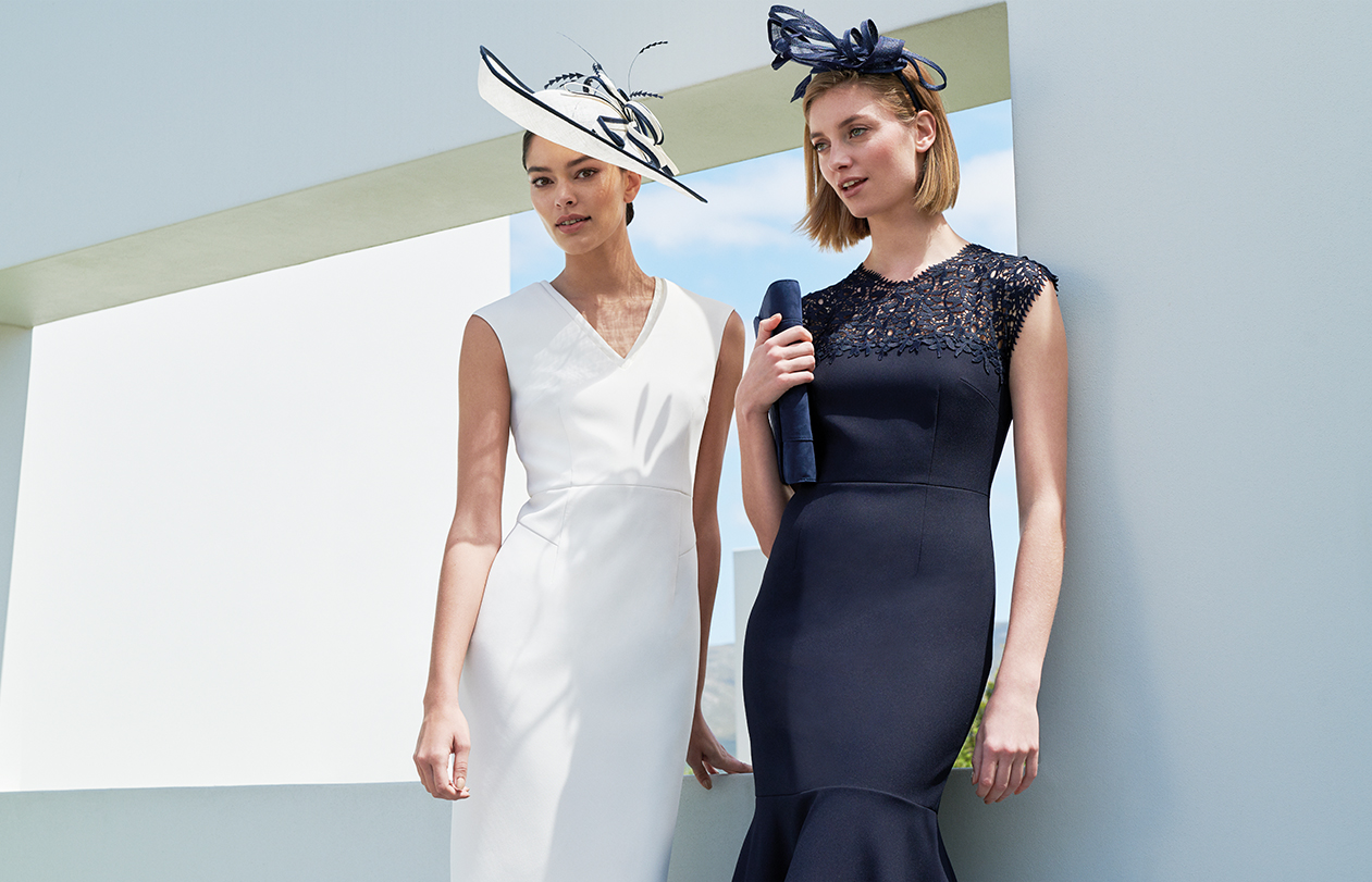 White occasion dress and navy occasion dress paired with matching fascinators by Hobbs.