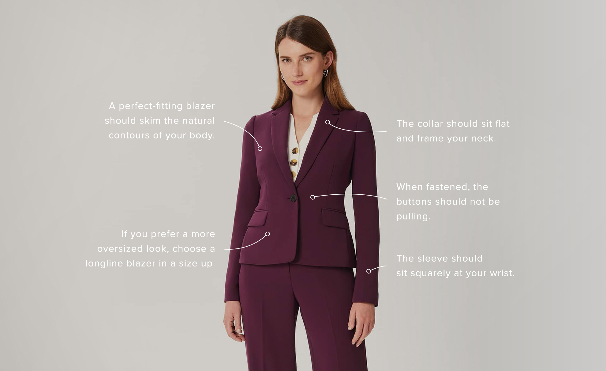 Hobbs model wears a berry coloured blazer.