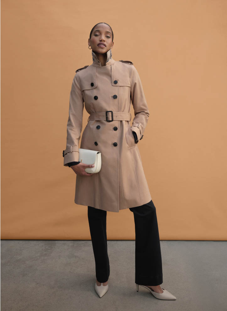 MODEL WEARING HOBBS SHOWER RESISTANT BEIGE TRENCH