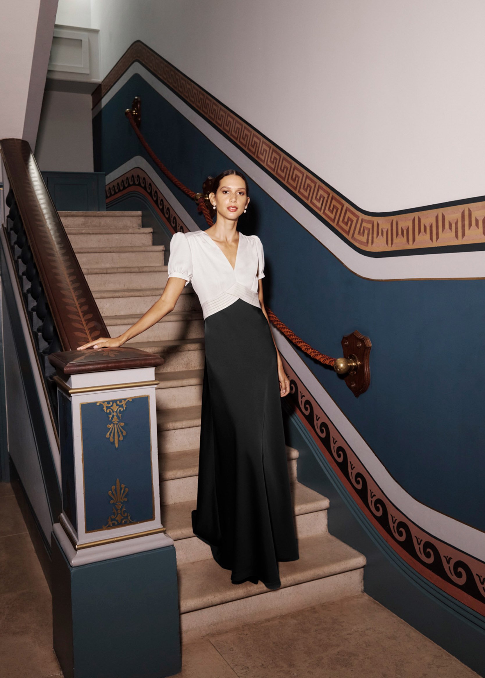 A woman wearing a Hobbs black and white ball gown.